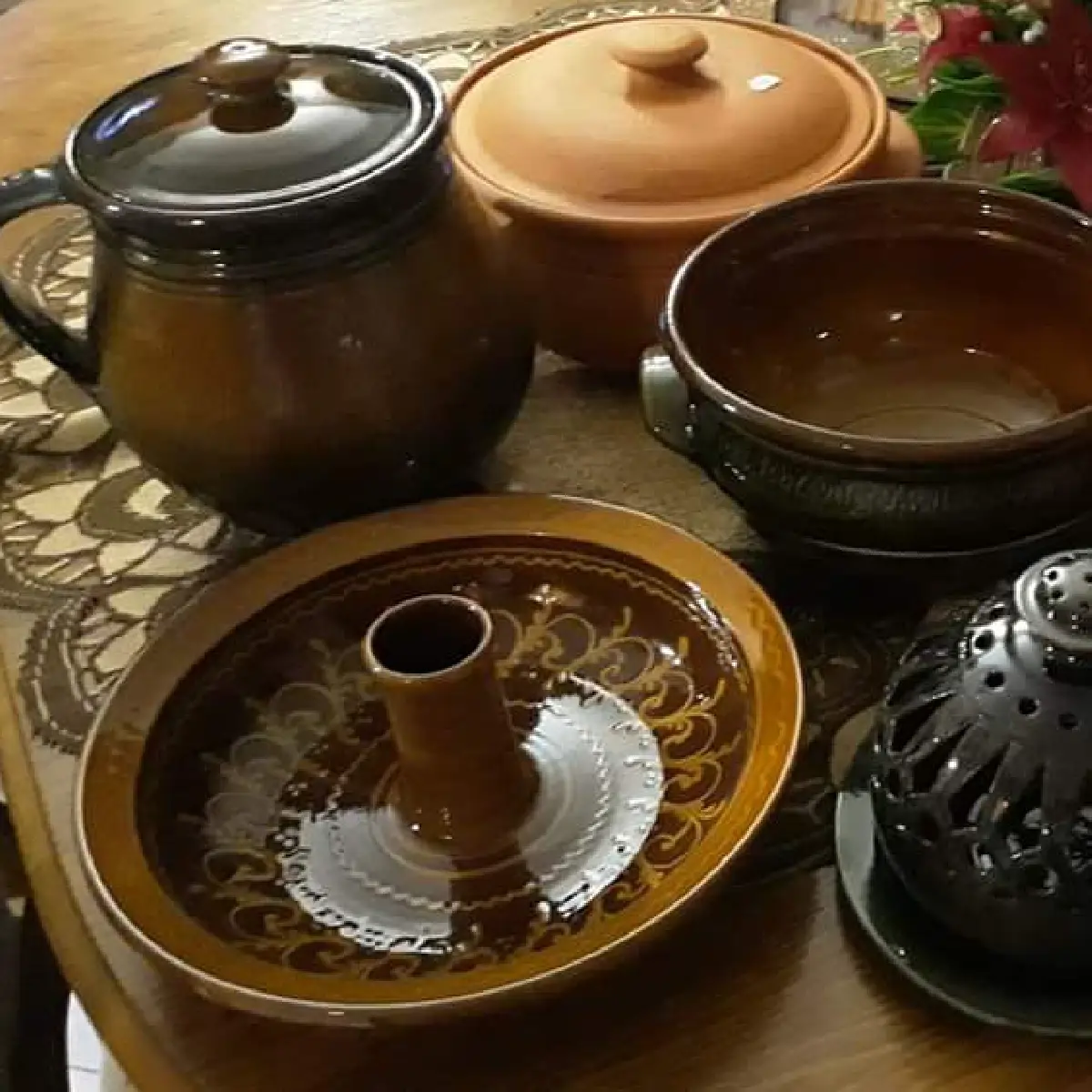 Ceramic cookware in a wood-fired oven with slower and more even heat transfer