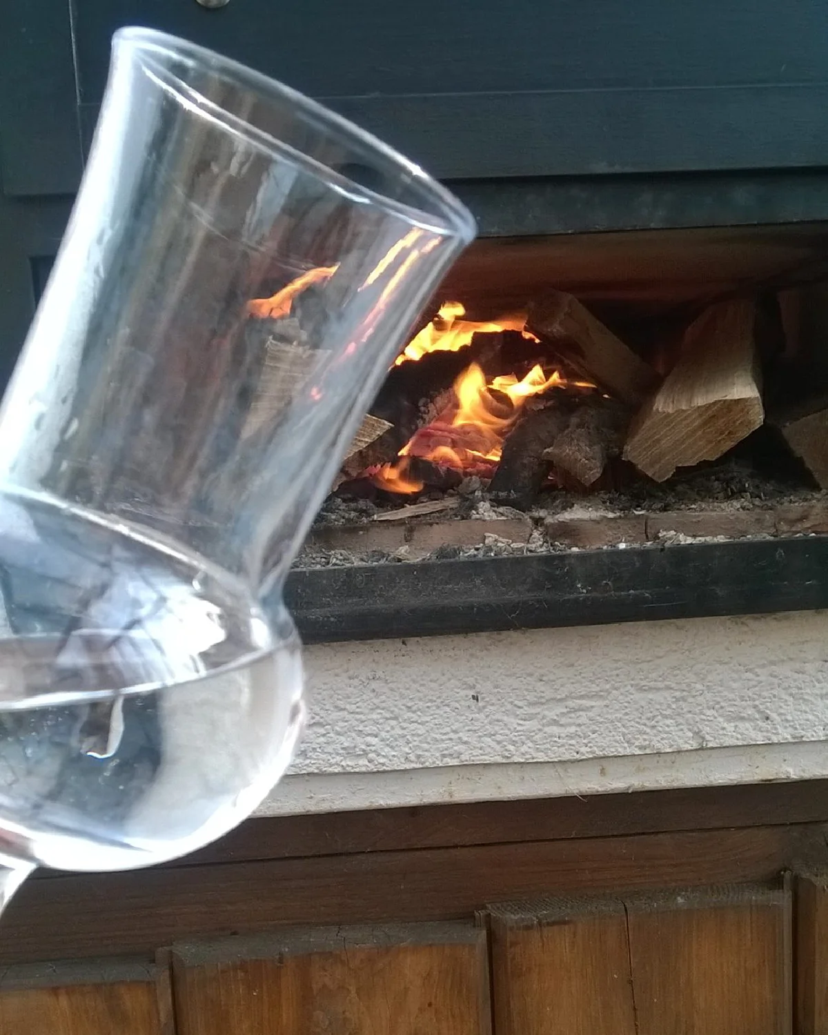 Atmospheric garden scene with a wood-fired oven and a well-planned chimney system