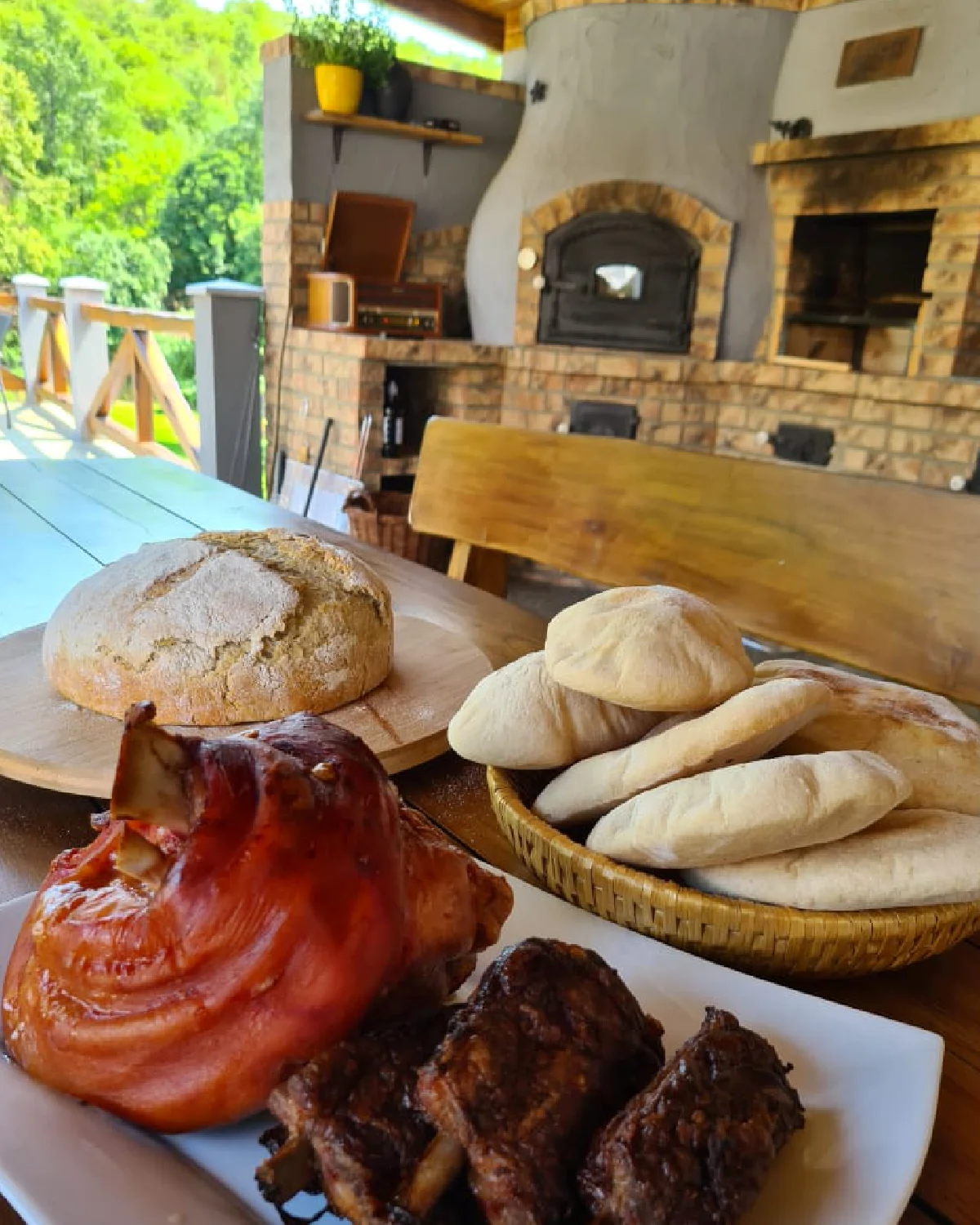 Masonry wood-fired oven built into an outdoor kitchen